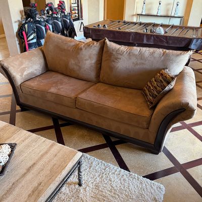 Sale Photo Thumbnail #29: Contemporary tan microfiber sofa with dark wood trim, flared arms, and matching throw pillow in a living room setting.