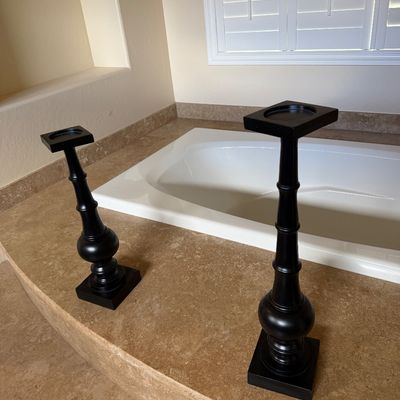 Sale Photo Thumbnail #9: Pair of black matte-finished wooden candle holders featuring turned pedestal stems and square bases.