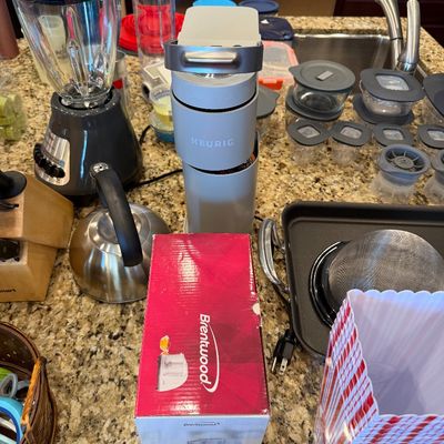 Sale Photo Thumbnail #169: Collection of small kitchen appliances and housewares, including a Keurig single-serve coffee maker, a blender, a stainless steel kettle, and a boxed Brentwood appliance.