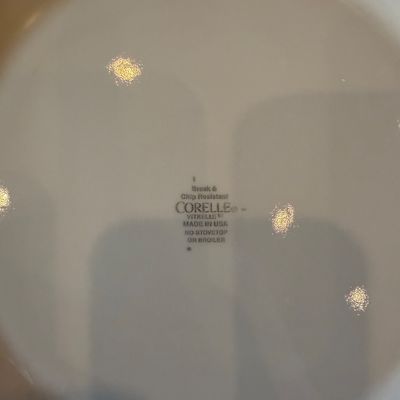 Sale Photo Thumbnail #180: Underside maker's mark on a white Corelle Vitrelle dinnerware piece.