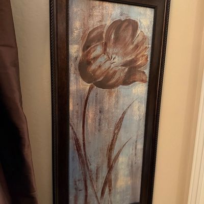 Sale Photo Thumbnail #147: Framed vertical canvas print featuring a stylized brown tulip with metallic gold accents on a muted blue and beige background.