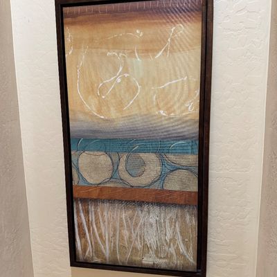 Sale Photo Thumbnail #153: Large vertical contemporary abstract painting featuring layered geometric and fluid designs in earth tones with teal accents, presented in a dark wood floating frame.