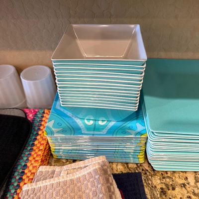 Sale Photo Thumbnail #160: Stack of turquoise and white square plastic bowls alongside matching patterned square plates.