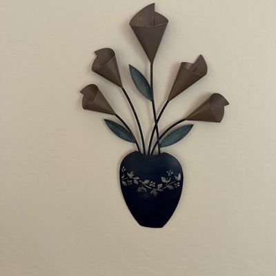 Sale Photo Thumbnail #10: Metal wall sculpture depicting calla lilies in a dark vase with floral stencil detailing.