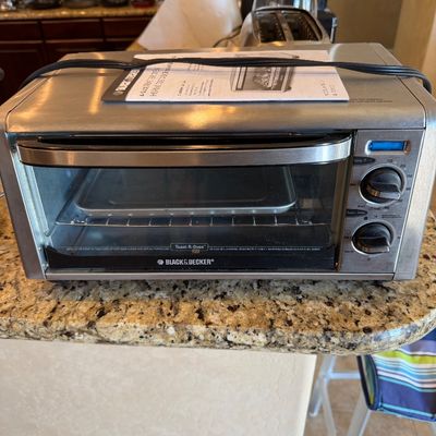 Sale Photo Thumbnail #194: Black & Decker stainless steel Toast-R-Oven countertop toaster oven, includes original user manual and baking rack.