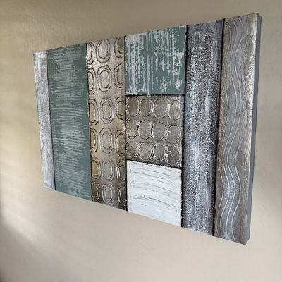Sale Photo Thumbnail #25: Contemporary modern textured abstract canvas wall art featuring metallic silver, muted green, and white geometric panels.