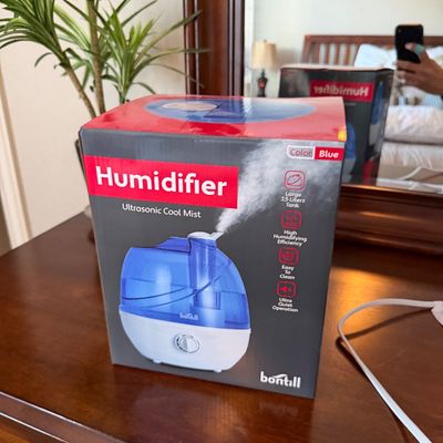 Sale Photo Thumbnail #127: Bontill ultrasonic cool mist humidifier in original retail packaging, featuring a 2.5-liter blue tank.