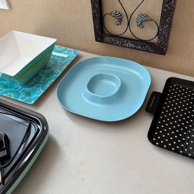 Sale Photo Thumbnail #197: Selection of modern servingware including a light blue chip-and-dip platter, a patterned rectangular tray with a square bowl, and a black polka dot tray.