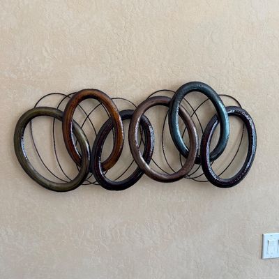 Sale Photo Thumbnail #224: Contemporary metal and resin interlocking ring wall sculpture featuring earth-toned metallic finishes.