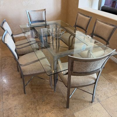 Sale Photo Thumbnail #214: Contemporary metal dining set with rectangular glass top table and six upholstered armchairs.