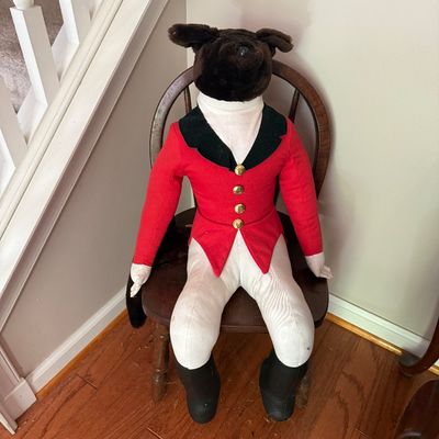 Sale Photo Thumbnail #73: Vintage stuffed fox figure dressed in traditional English fox hunting attire with a red coat, sitting on a child's wooden armchair.