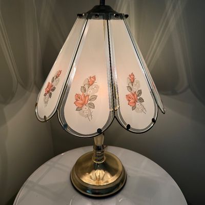 Sale Photo Thumbnail #24: Vintage touch lamp featuring frosted glass shade panels with floral rose accents and a brass-tone metal base.