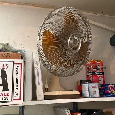 Sale Photo Thumbnail #160: Vintage electric table fan with amber blades and a wire guard