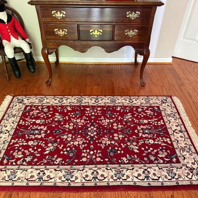 Sale Photo Thumbnail #80: Traditional Persian-style area rug featuring a red field with intricate floral motifs and fringe trim.
