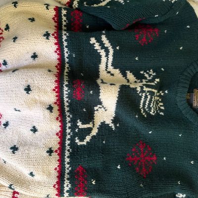 Sale Photo Thumbnail #6: Vintage Eddie Bauer heavy knit wool sweater featuring a reindeer, snowflake, and Fair Isle-style motif in green, cream, and red.