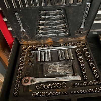 Sale Photo Thumbnail #146: Vintage Craftsman mechanic's tool set, complete with sockets, ratchets, and wrenches in a black molded blow-plastic carrying case.