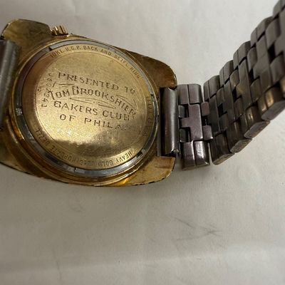 Sale Photo Thumbnail #2: Vintage 10k gold-toned 1972 Bulova wristwatch of NFL Eagles great Tom Brookshier. Engraved case back reading "Presented to Tom Brookshier, Bakers Club of Phila.".  