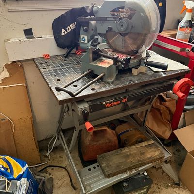 Sale Photo Thumbnail #164: Delta 10-inch compound miter saw mounted on a Black & Decker Workmate 425 portable project center workbench.
