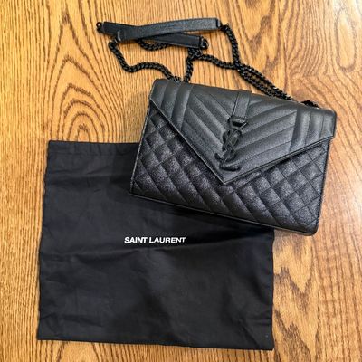 Sale Photo Thumbnail #13: Black Saint Laurent quilted leather handbag with a chain shoulder strap and matching black YSL logo, with original dust bag.