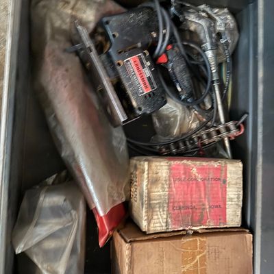 Sale Photo Thumbnail #148: Tool drawer filled with various power tools, including a vintage Craftsman double-insulated jig saw, along with boxed parts and accessories.