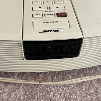 Sale Photo Thumbnail #129: Vintage off-white Bose Wave Radio featuring top panel controls and digital display.
