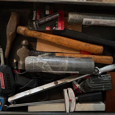 Sale Photo Thumbnail #151: Toolbox drawer filled with hand tools, including a Weller soldering gun, several ball-peen and dead blow hammers, solder tubes, and a torque wrench.