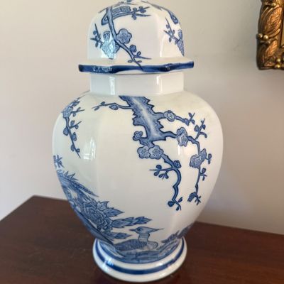 Sale Photo Thumbnail #78: Asian-style blue and white porcelain ginger jar featuring hand-painted cherry blossom and waterfowl motifs, complete with a matching lid.