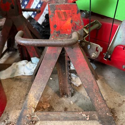 Sale Photo Thumbnail #155: Vintage red Walker ratcheting jack stand showing heavy cosmetic wear and surface rust.