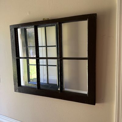Sale Photo Thumbnail #169: Rustic wall mirror fashioned from a dark brown wooden six-pane window frame.