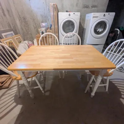 Five-piece dining set featuring a light wood rectangle tabletop with painted white turned legs and four matching white Windsor-style chairs.