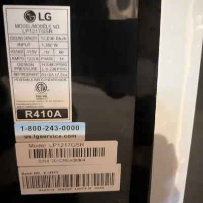 Specification and serial number sticker on an LG portable air conditioner, model LP1217GSR.