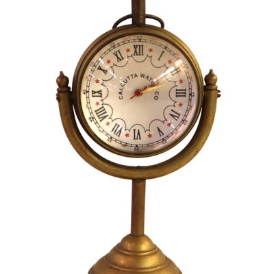 Sale Photo Thumbnail #107: Calcutta Watch Co brass quartz desk clock. 5"h x 3"w x 2"d