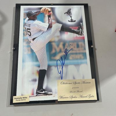 Sale Photo Thumbnail #136: Framed autographed photo of Dontrelle Willis in a Florida Marlins uniform, featuring a commemorative plaque from the Oklahoma Sports Museum's Seventh Annual Warren Spahn Award Gala.