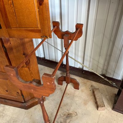 Sale Photo Thumbnail #49: Vintage freestanding wooden quilt rack with turned spindles and scrolled side supports, positioned next to a pine cabinet.