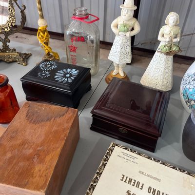 Sale Photo Thumbnail #14: Collection of decorative household items including wooden boxes, an Arturo Fuente cigar box, pilgrim figurines, and a vintage glass milk jug.