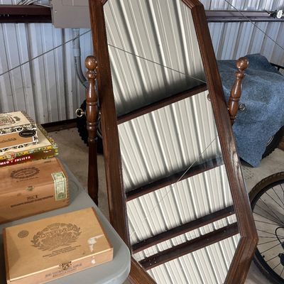 Sale Photo Thumbnail #19: Vintage dark wood full-length cheval mirror with an octagonal frame and turned posts, displayed alongside a selection of wooden cigar boxes.