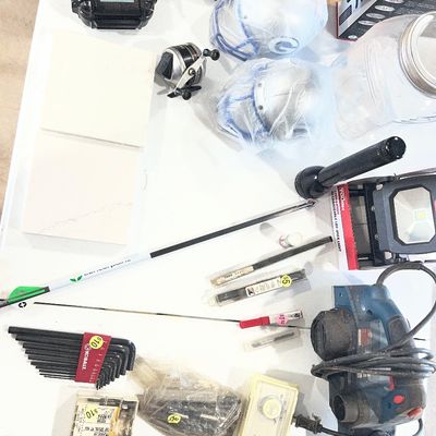 Sale Photo Thumbnail #13: Assorted workshop items, tools, and sports memorabilia including a power planer, hex key set, work lights, fishing reel, mini helmets, and arrows.