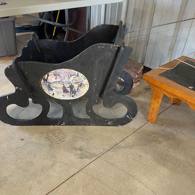 Sale Photo Thumbnail #34: Vintage black painted wooden decorative sleigh featuring an oval winter scene illustration on the side.