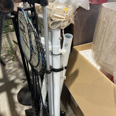 Sale Photo Thumbnail #132: Portable EastPoint badminton set featuring racquets, net poles, and a caddy storage stand.