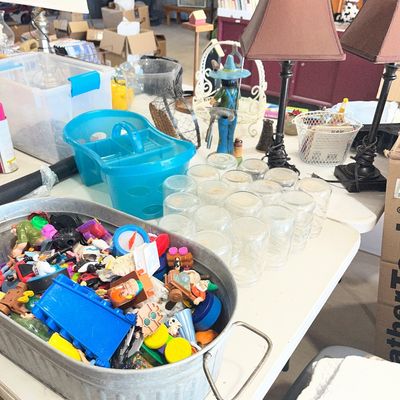 Sale Photo Thumbnail #20: Galvanized tub filled with assorted small plastic toys alongside glass jars and household lamps displayed on a table.