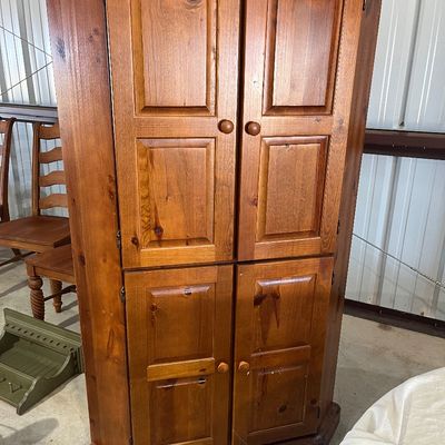 Sale Photo Thumbnail #135: Traditional pine corner hutch featuring raised panel doors and round wooden knobs.