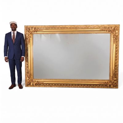 Sale Photo Thumbnail #64: Monumental Gilt Mirror with Floral Corners