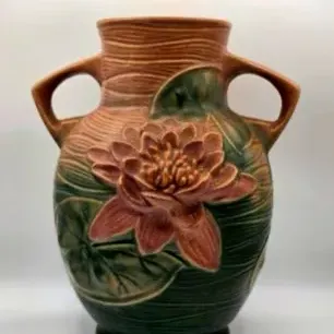 Roseville Pottery Water Lily double-handled vase in brown and green matte glaze, featuring embossed pink water lily blooms, circa 1940s.