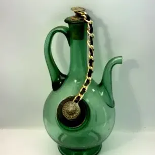 Vintage green glass wine decanter pitcher featuring a side ice pocket and a cork stopper secured with a decorative chain.