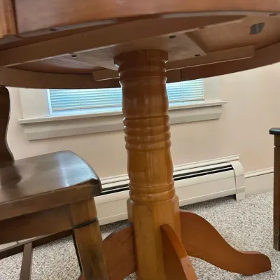 Round Pedestal Dining Table with Two Allen Chair Corp. Armchairs