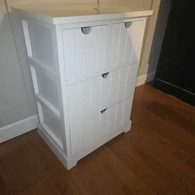 Sale Photo Thumbnail #14: White painted wooden storage cabinet or nightstand featuring wainscoting-style beadboard drawer fronts and cut-out handles. Includes two smaller top drawers side-by-side over two full-width lower drawers. Appears in overall good, sturdy condition with lig