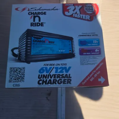 Sale Photo Thumbnail #145: Schumacher Charge 'n Ride 6V/12V automatic universal charger for ride-on toys (Model CR6). Designed for compatibility with 12V Peg Perego and 6V Kid Trax / Rollplay connectors. Appears to be in original retail box.