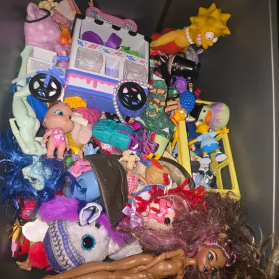Sale Photo Thumbnail #54: A large collection of assorted toys and accessories contained in a tub. Items include fashion dolls (Barbie style, Monster High style, and Aladdin character), Ty Beanie Babies plush animals (pink Sakura bear and purple princess bear), a pink Barbie RC Mon