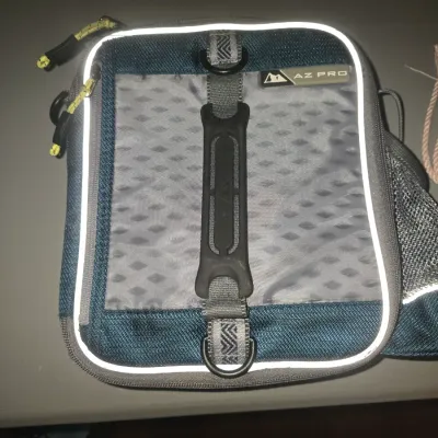 Sale Photo Thumbnail #72: Arctic Zone AZ Pro insulated lunch tote/bag in blue and gray. Features zipper closure with neon pulls, top carrying handle, reflective trim, exterior pocket, and side mesh pocket. Appears lightly used in good condition.