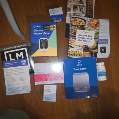 Sale Photo Thumbnail #41: Collection of Virta Health health and wellness items. Includes a Virta Glucose Ketone Meter in original box, Virta digital food scale in box, Virta test strips, sterile lancets, McKesson alcohol prep pads, LMNT electrolyte drink mix sample pack, Mag64 mag